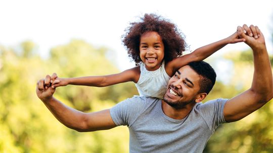 male foster carer with child